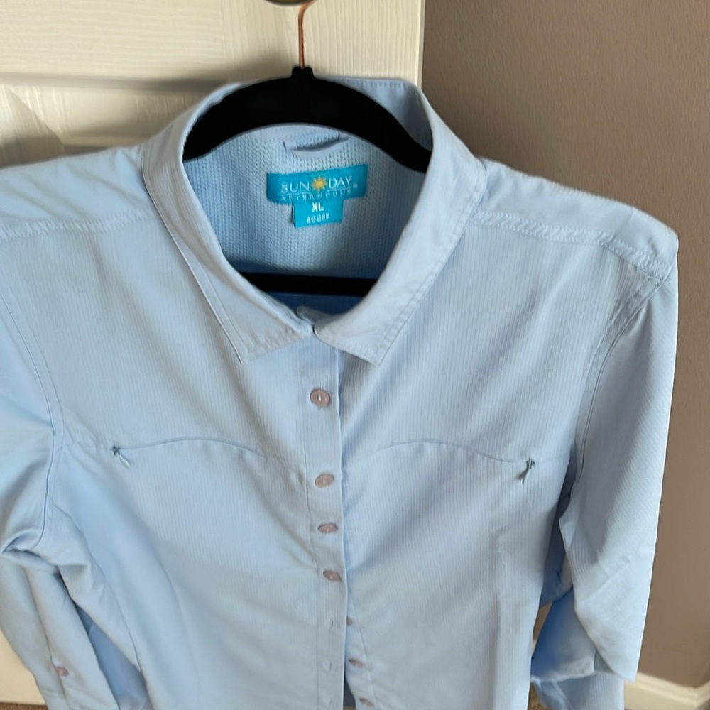Beautiful shirt for a day in the sun.  UPF 40.  Has 2 zip pockets on front.